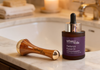 Urban Veda Kansa Wand with Radiance Facial Oil display on the sink