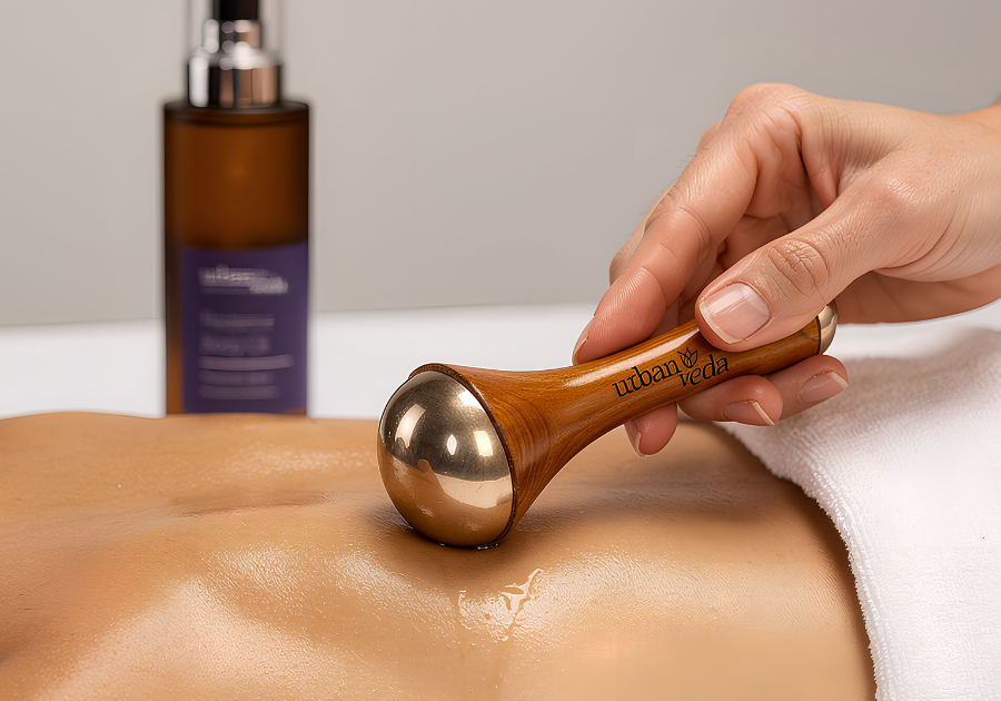 Urban Veda Kansa Wand Used on a person with Urban Veda Radiance body oil