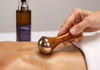 Urban Veda Kansa Wand Used on a person with Urban Veda Radiance body oil
